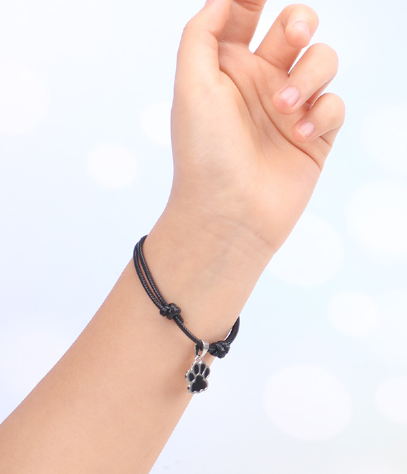 Adjustable Cord Bracelet with Black and White Dog Paw Charms