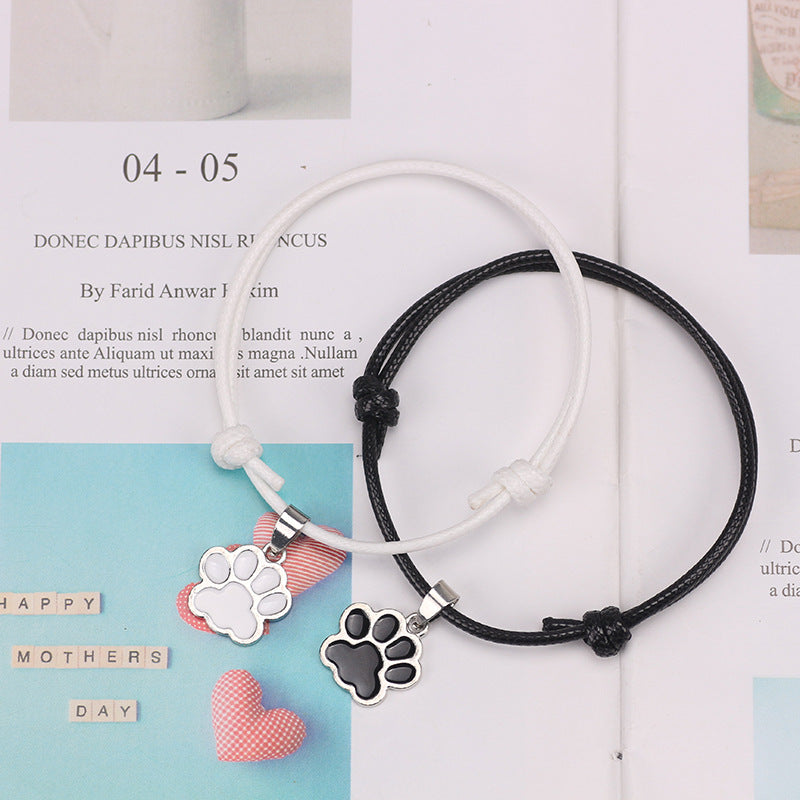 Adjustable Cord Bracelet with Black and White Dog Paw Charms